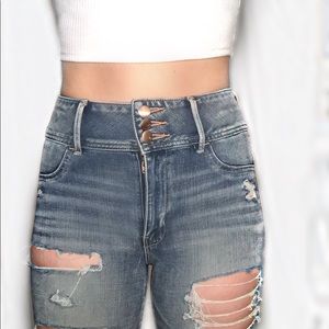 Distressed super stretch high rise jeans